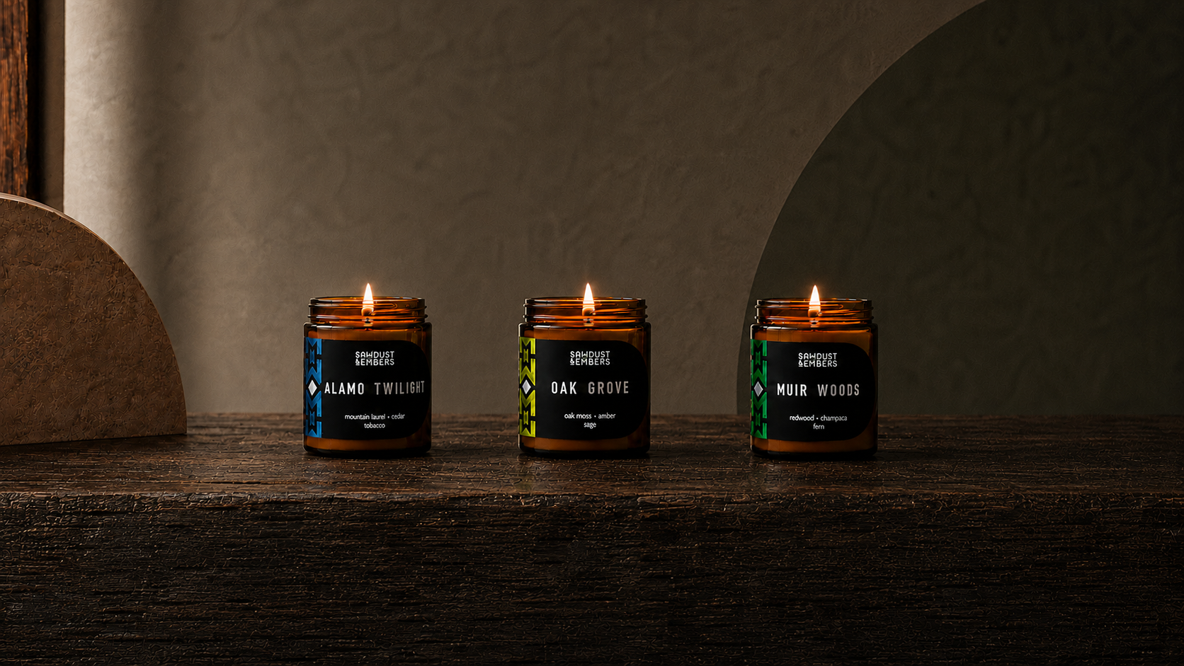 Sawdust & Embers Foundations collection featuring Alamo Twilight, Oak Grove, and Muir Woods candles.